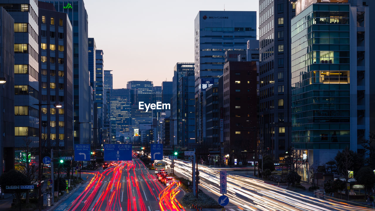 Light trails on road in city at night