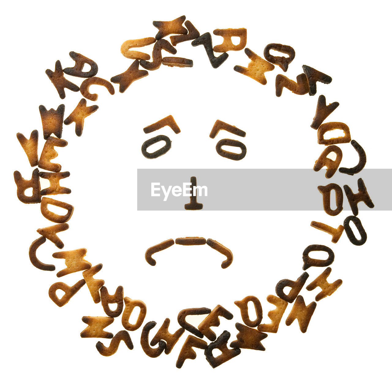 Anthropomorphic face made of alphabets over white background