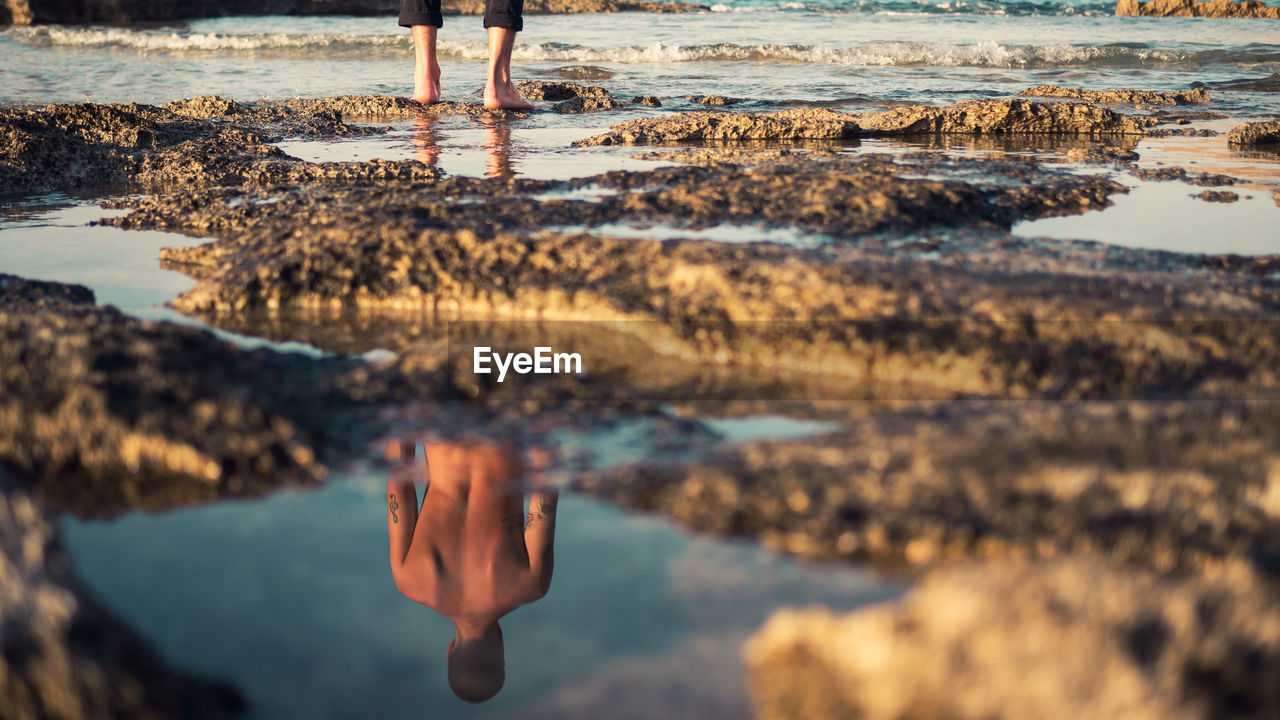 Low section of man on beach