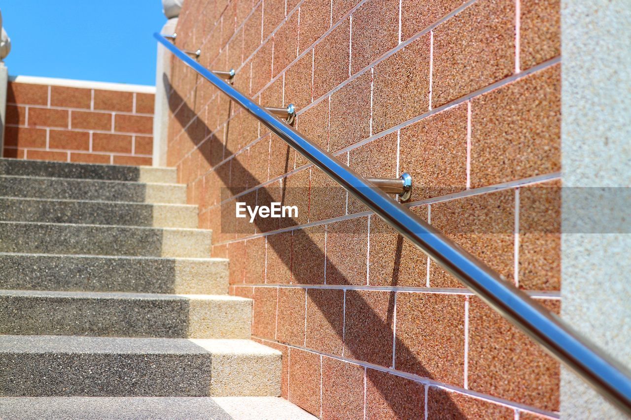 Shadow of staircase on building wall