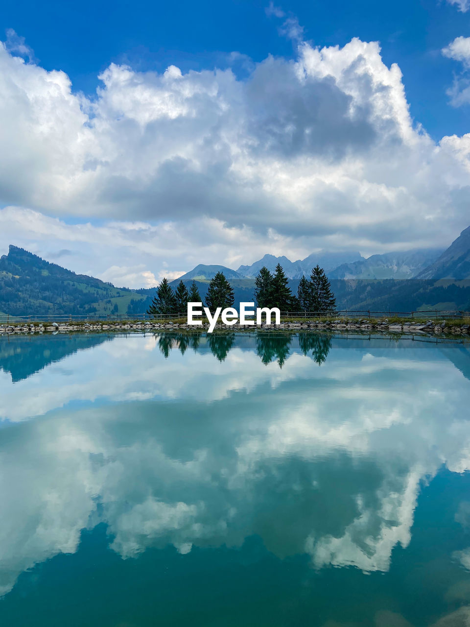 REFLECTION OF CLOUDS IN LAKE