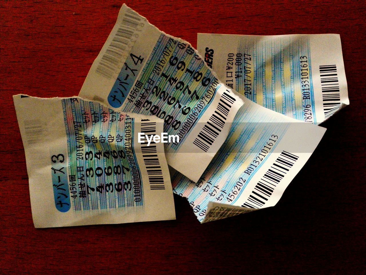 High angle view of torn lottery tickets on table