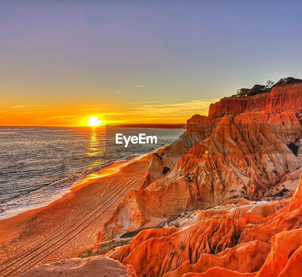 Scenic view of sea against sky during sunset