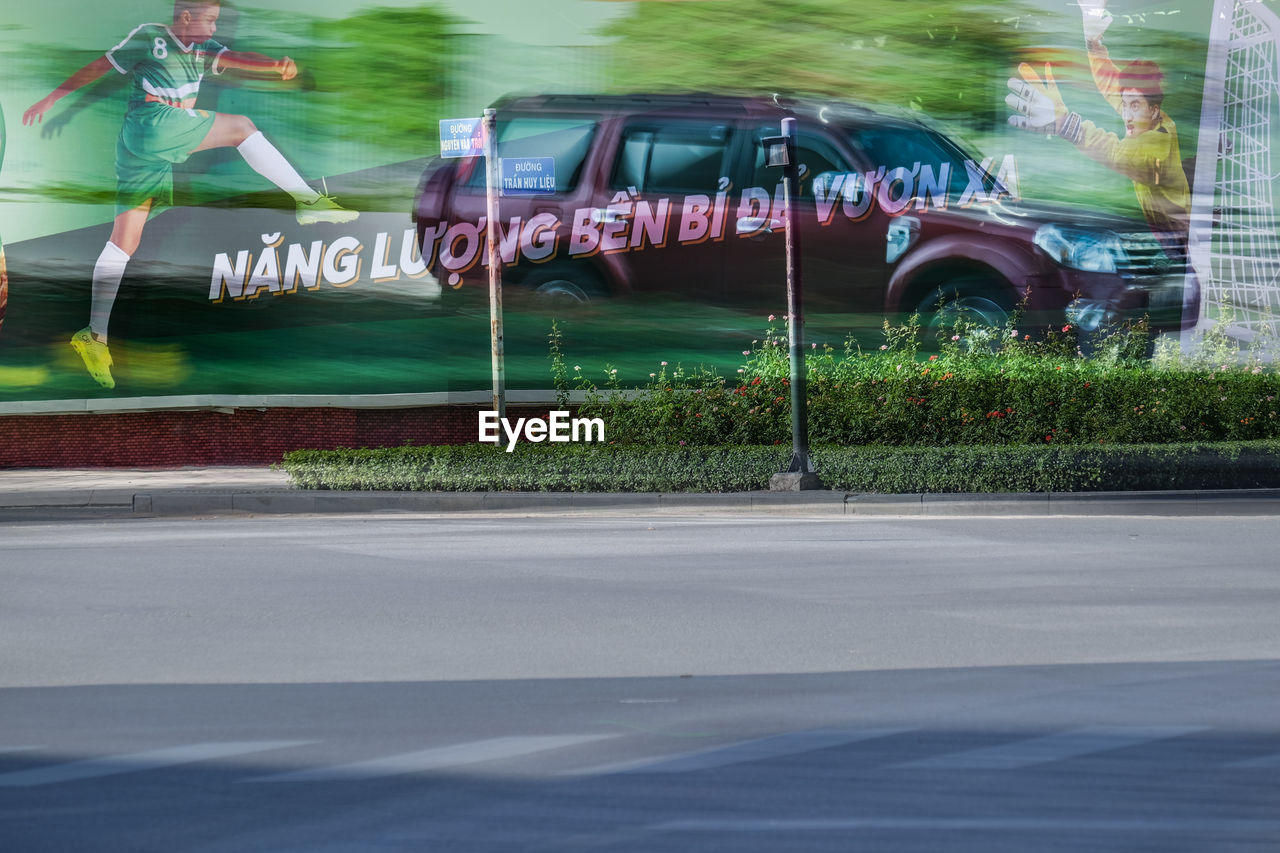 BLURRED MOTION OF BUS ON ROAD