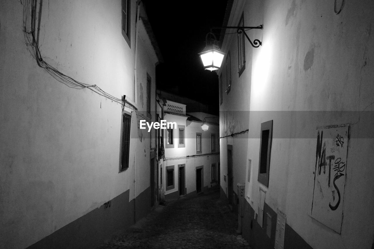 NARROW WALKWAY AT NIGHT