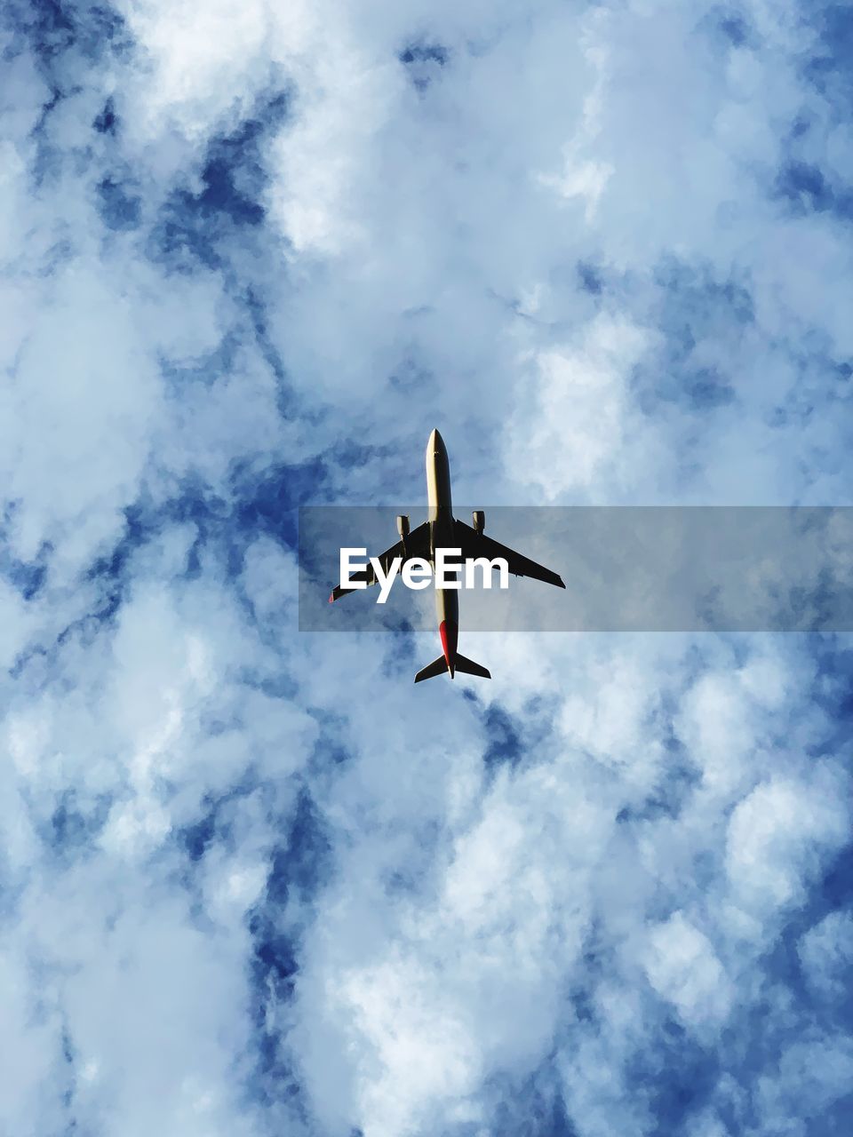 LOW ANGLE VIEW OF AIRPLANE IN FLIGHT