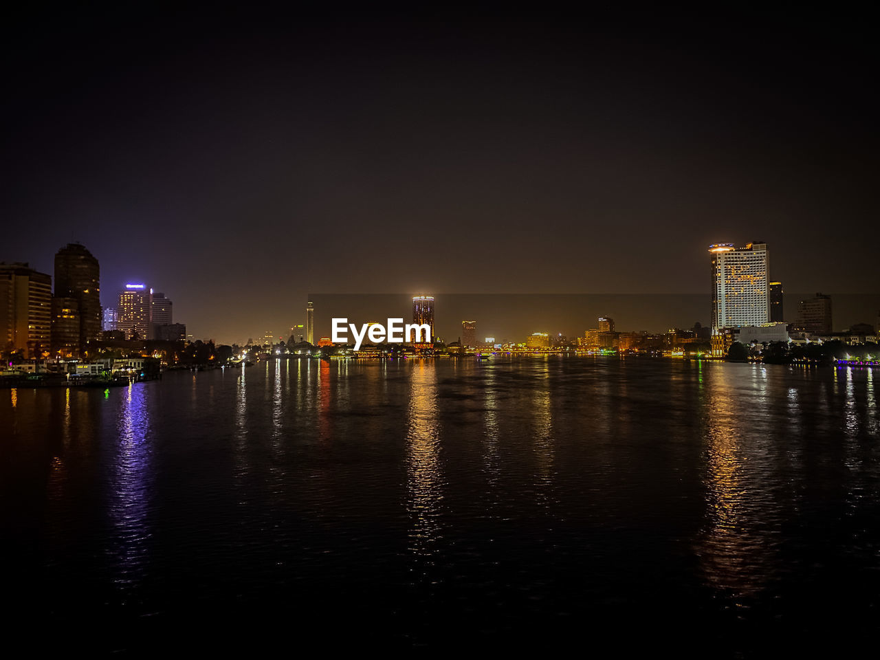 View of buildings lit up at night