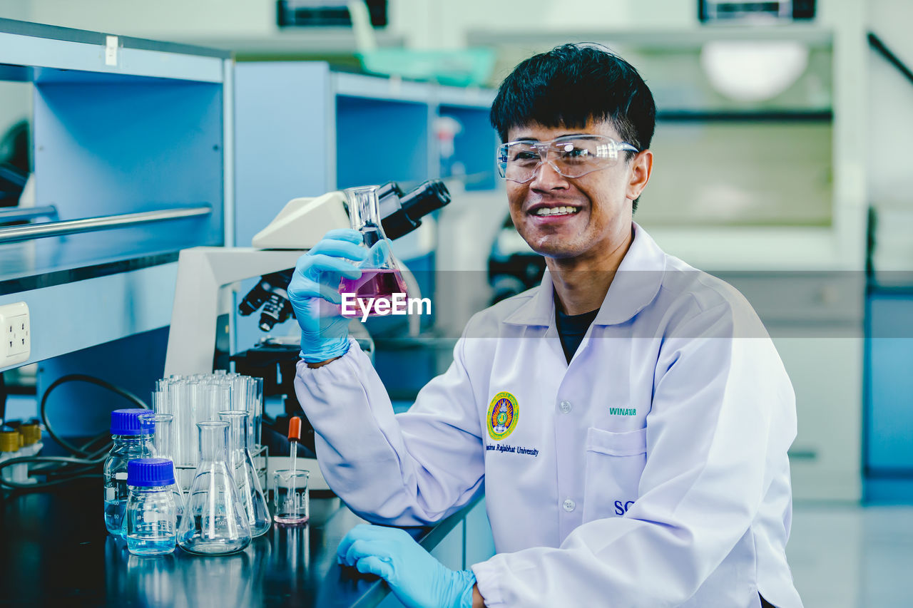 Portrait of young male scientist working in laboratory