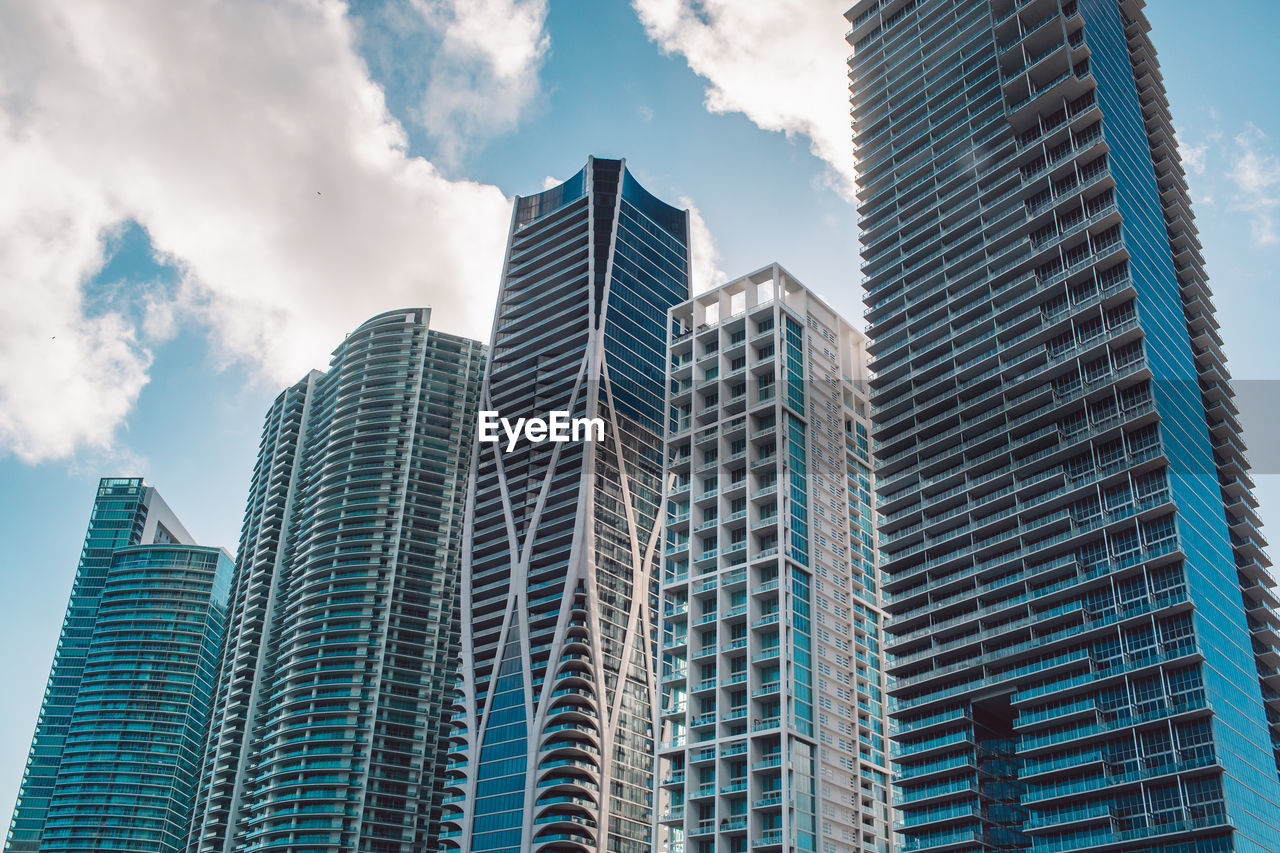 low angle view of skyscrapers against sky