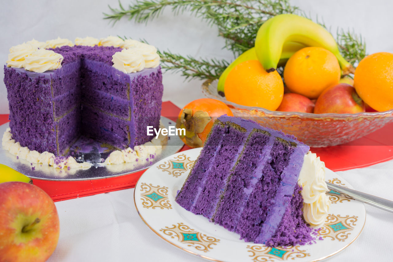 Close-up of cake and fruits on table during christmas