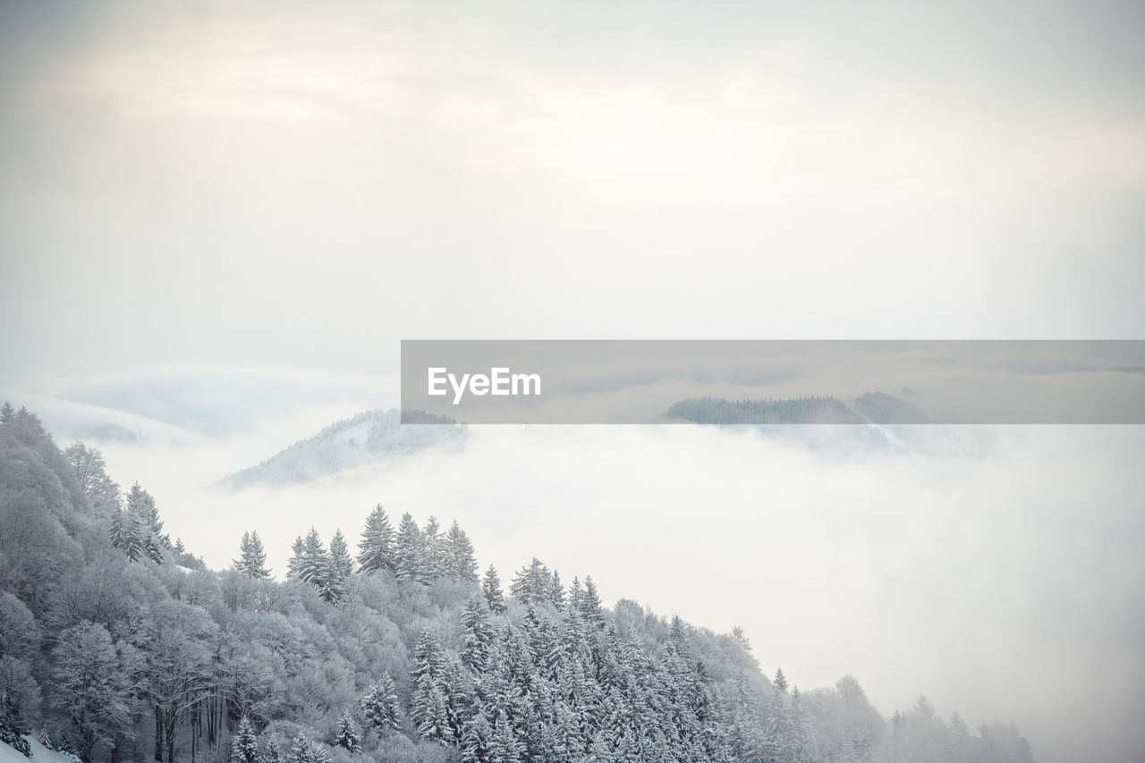 Scenic view of mountains against sky during winter
