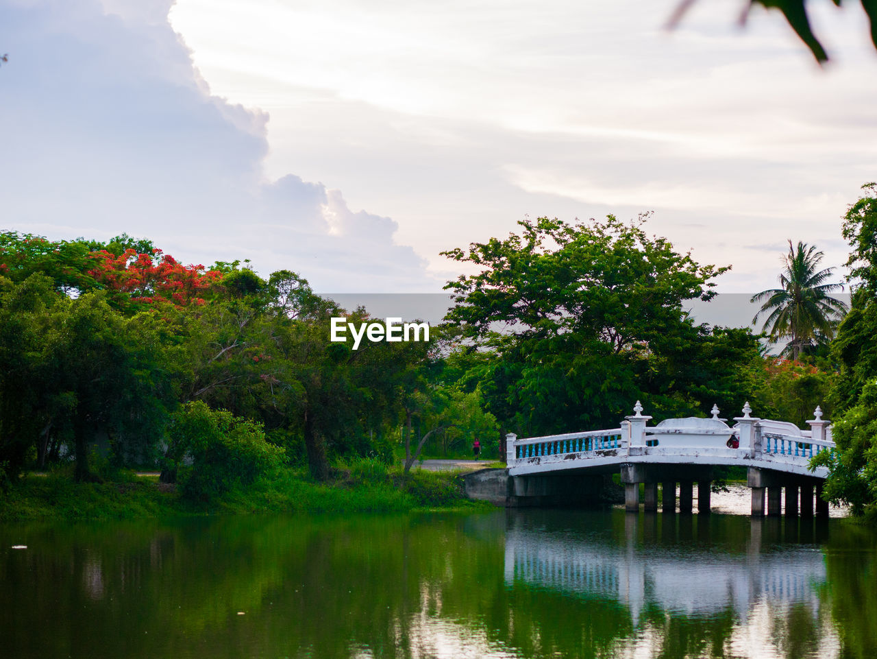 BUILT STRUCTURE BY LAKE AGAINST SKY