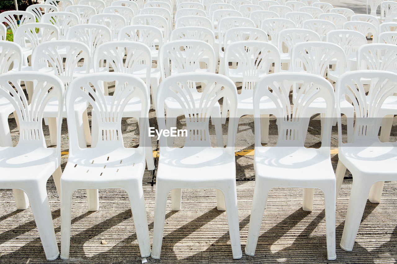 High angle view of arranged empty chairs outdoors