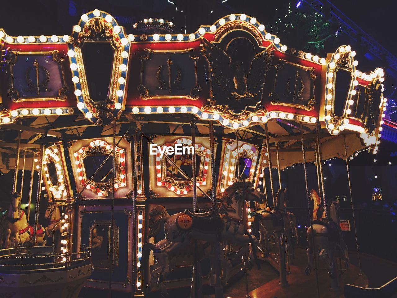 Illuminated carousel at night