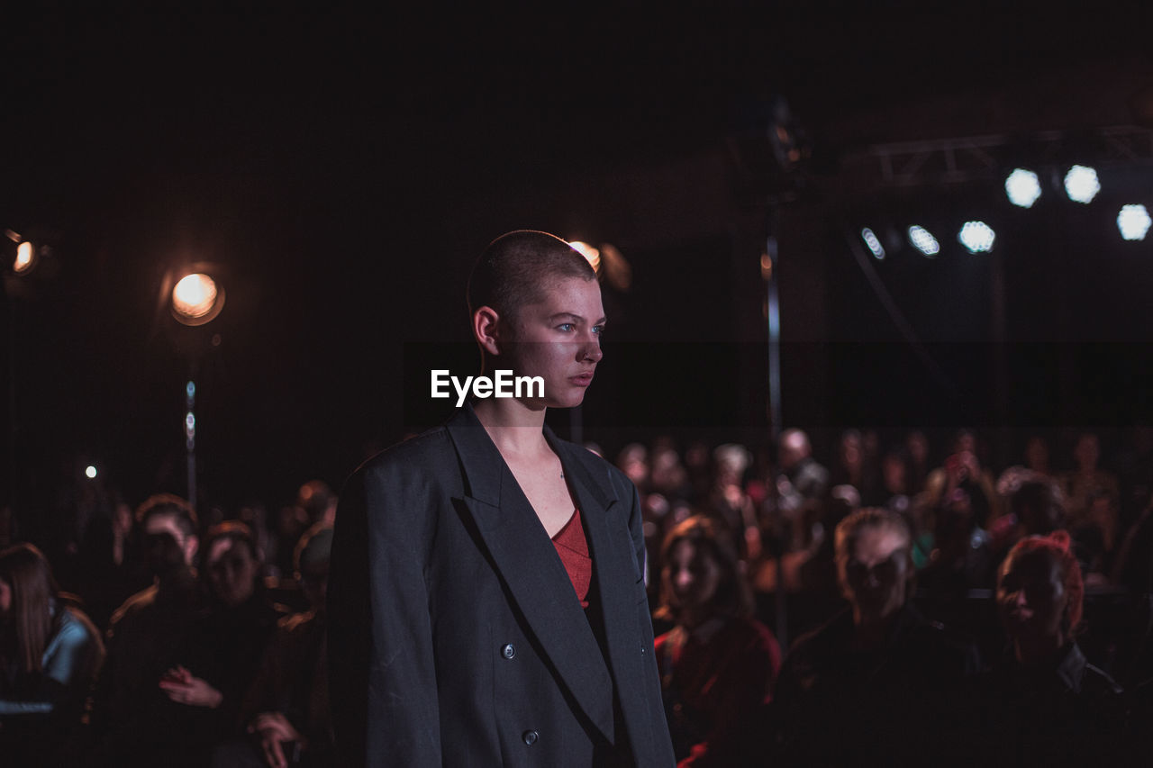 CROWD LOOKING AT MUSIC CONCERT