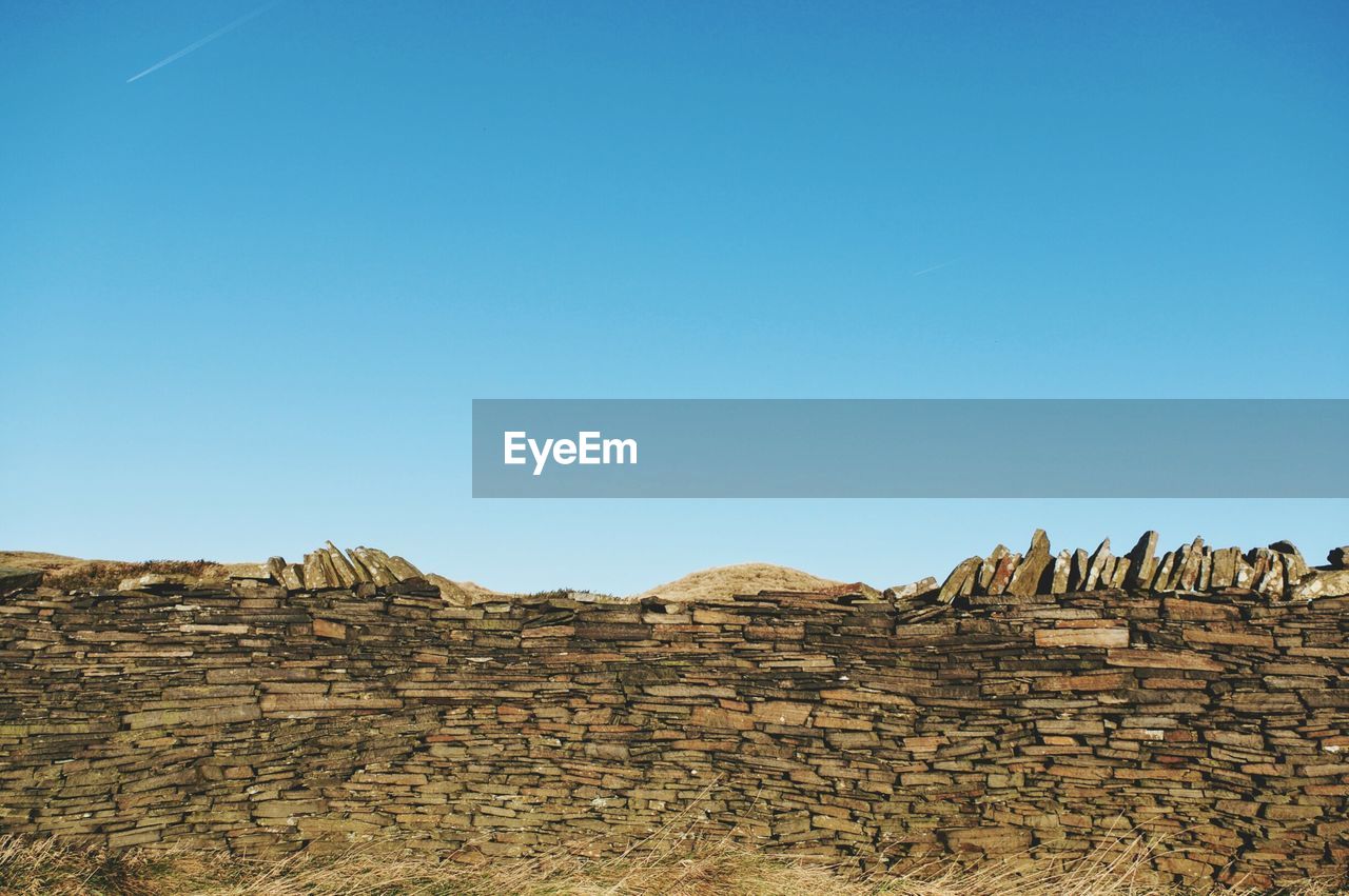 ROCKS AGAINST CLEAR BLUE SKY