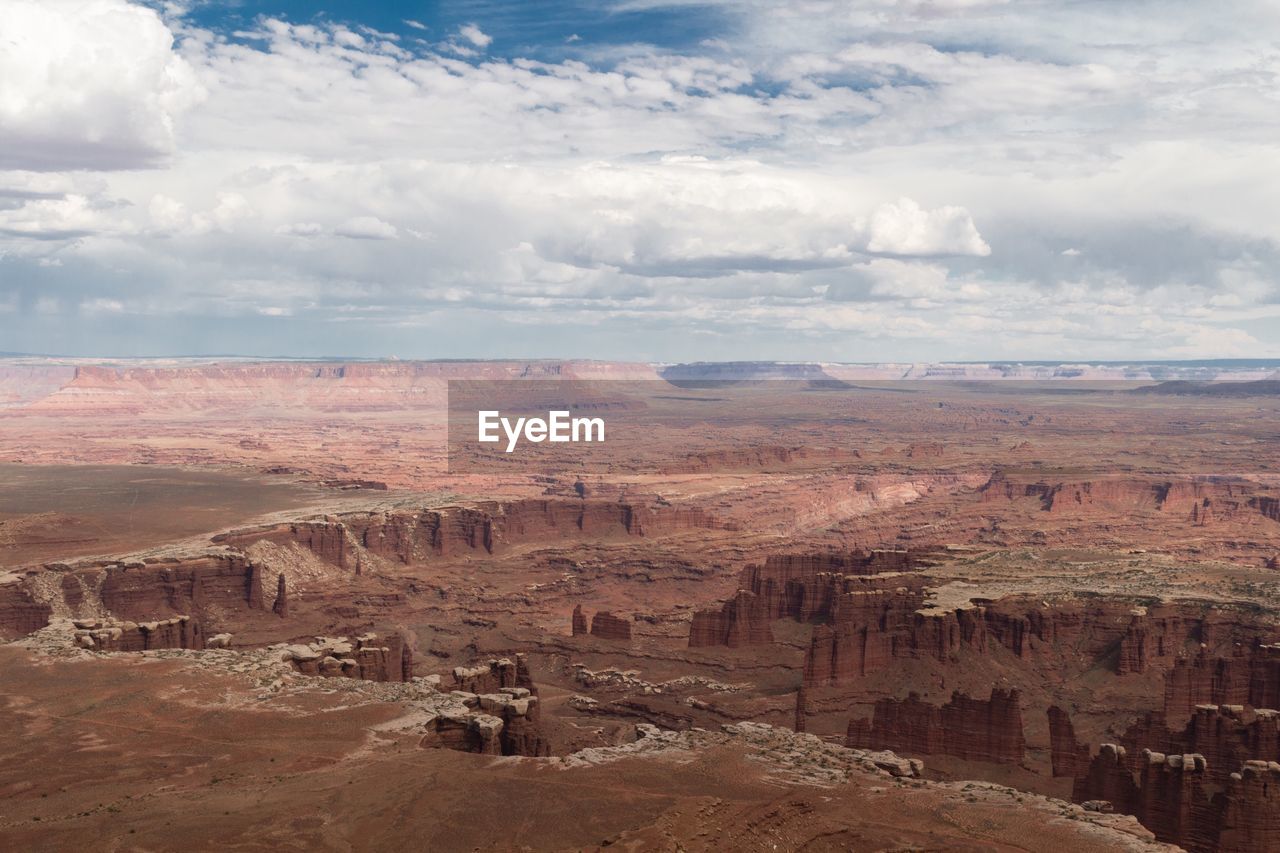 Aerial view of desert against dramatic sky