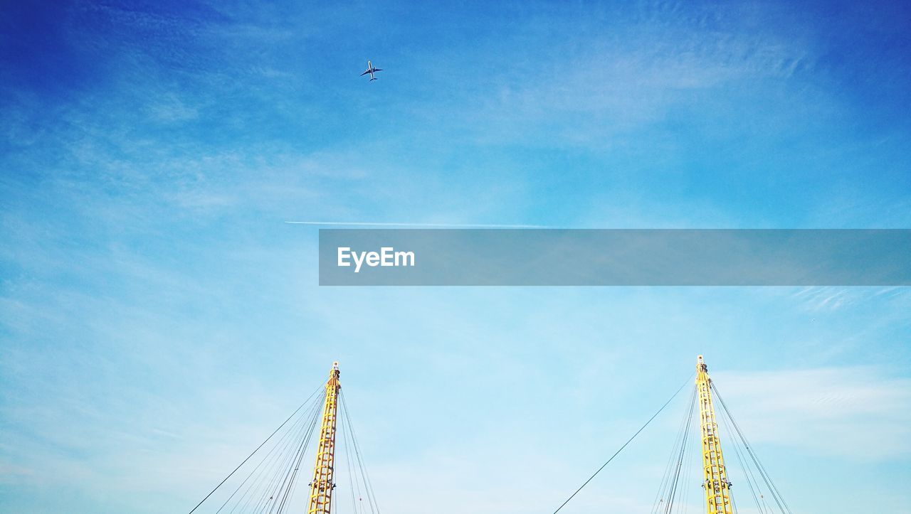 Cropped image of metallic bridge against sky