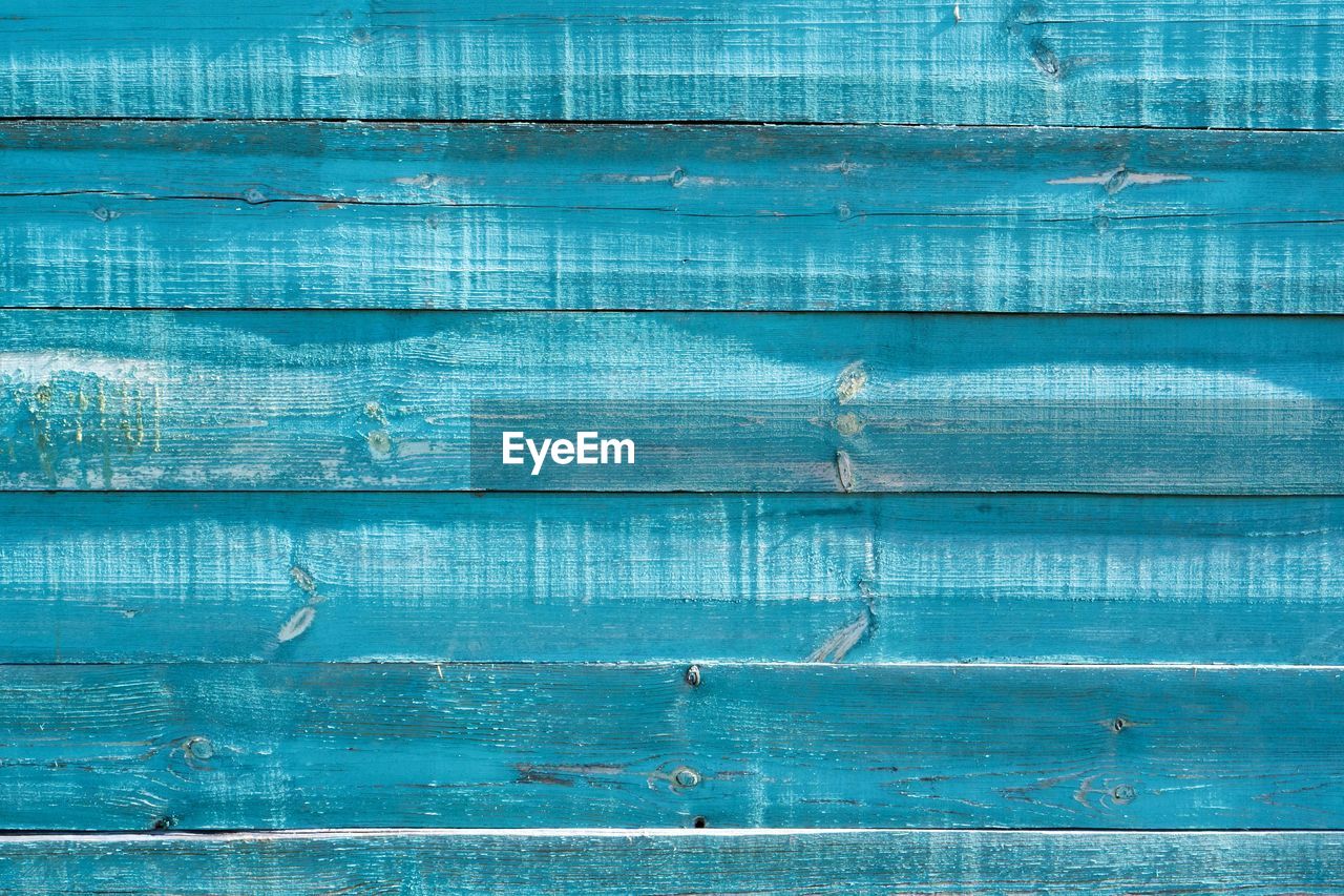 Full frame shot of blue weathered wood