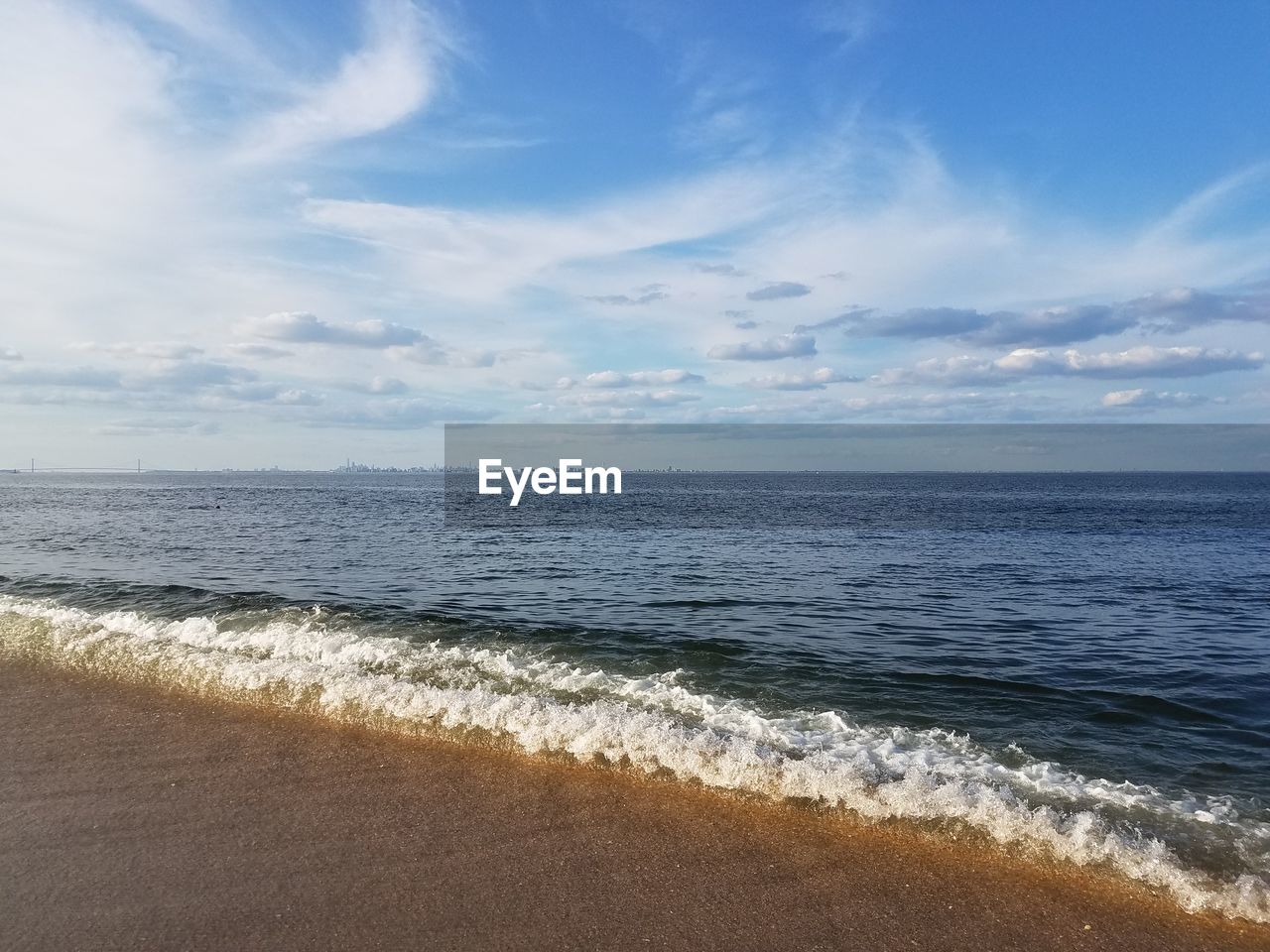 VIEW OF SEA AGAINST CLOUDY SKY