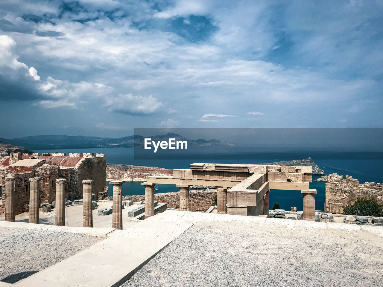 Ancient architecture of greece with a deep sea view. acropolis of lindos.