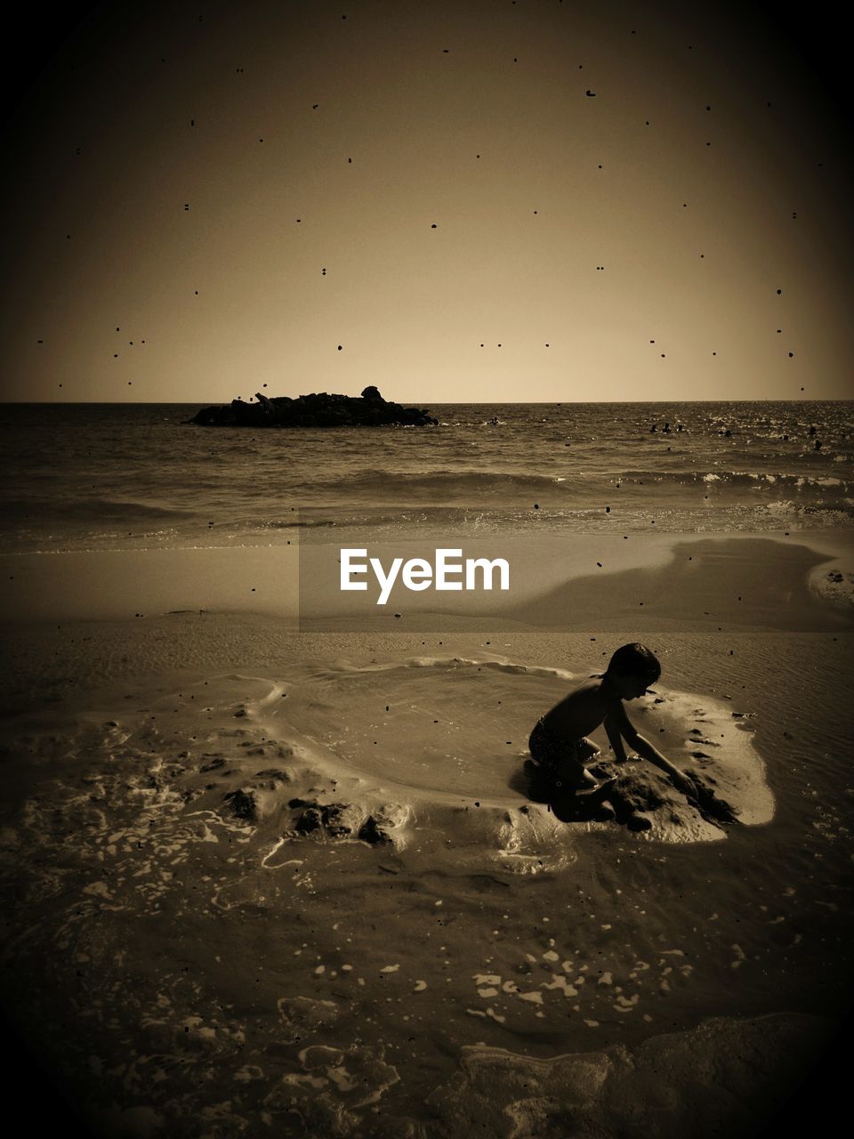 Boy playing in sand