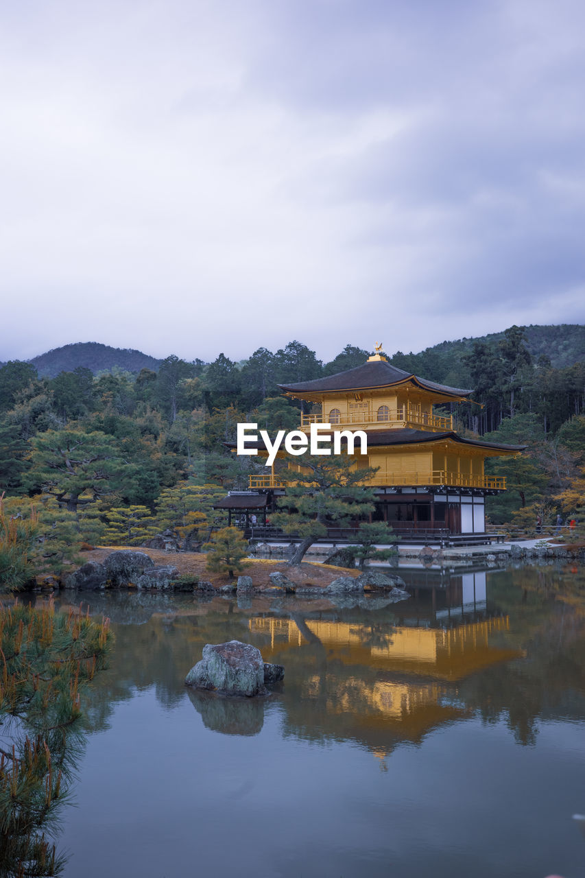 reflection, architecture, water, building, built structure, building exterior, lake, sky, nature, travel destinations, mountain, landscape, cloud, house, environment, morning, travel, religion, tourism, tradition, no people, scenics - nature, temple - building, history, beauty in nature, tranquility, residential district, outdoors, the past, tree, city, land, reservoir, belief, place of worship, village, rural scene, plant, mountain range, tranquil scene, trip