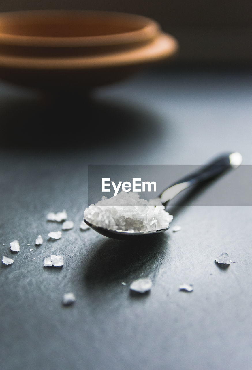 Close-up of salt on table