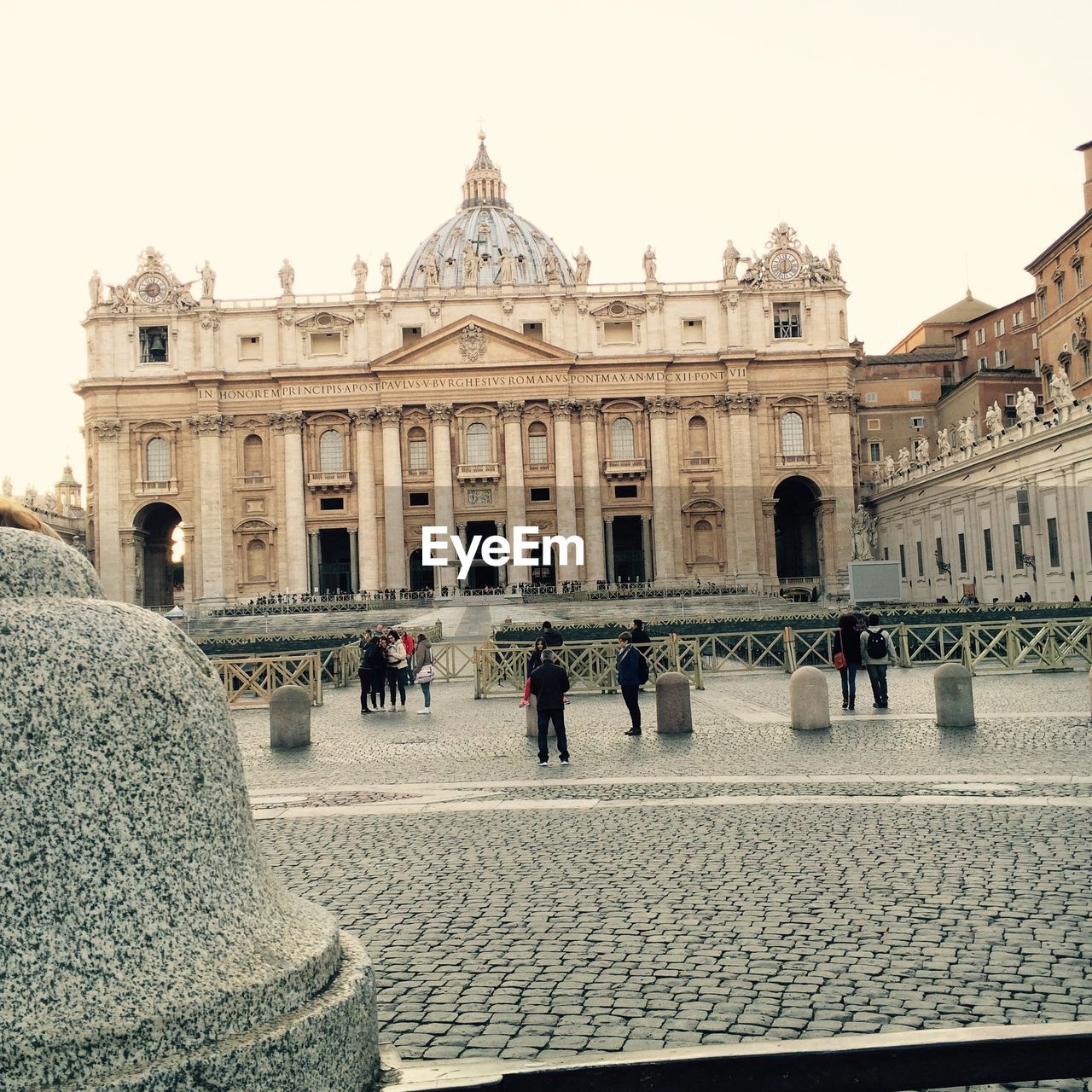 Tourist visiting basilica di san pietro against clear sky