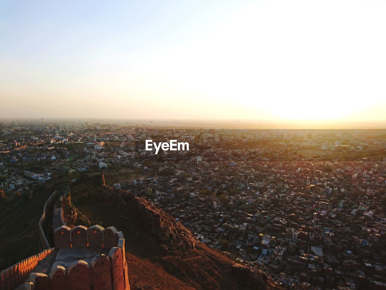High angle view of city against sky during sunset