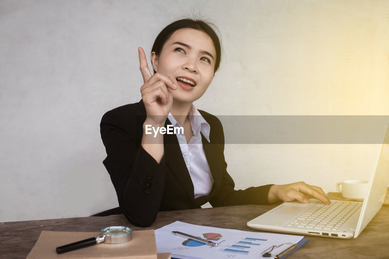 Young businesswoman working on laptop at office