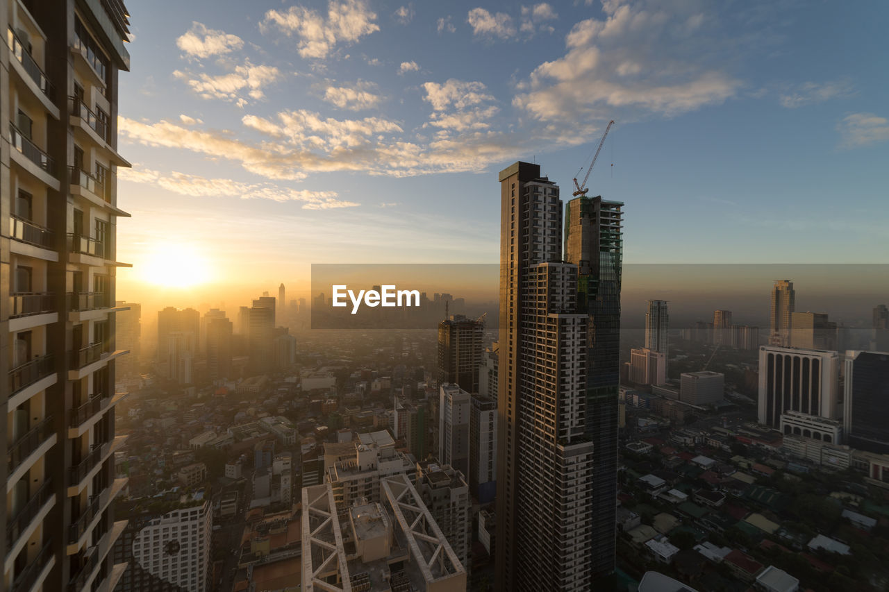 High angle view of cityscape against sky during sunset