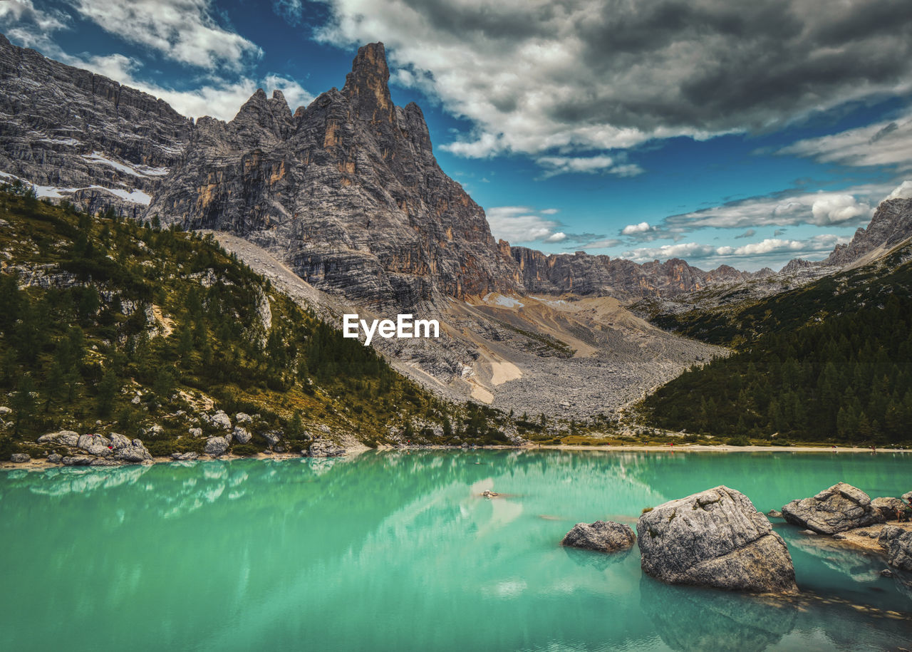 Scenic view of lake and mountains against sky