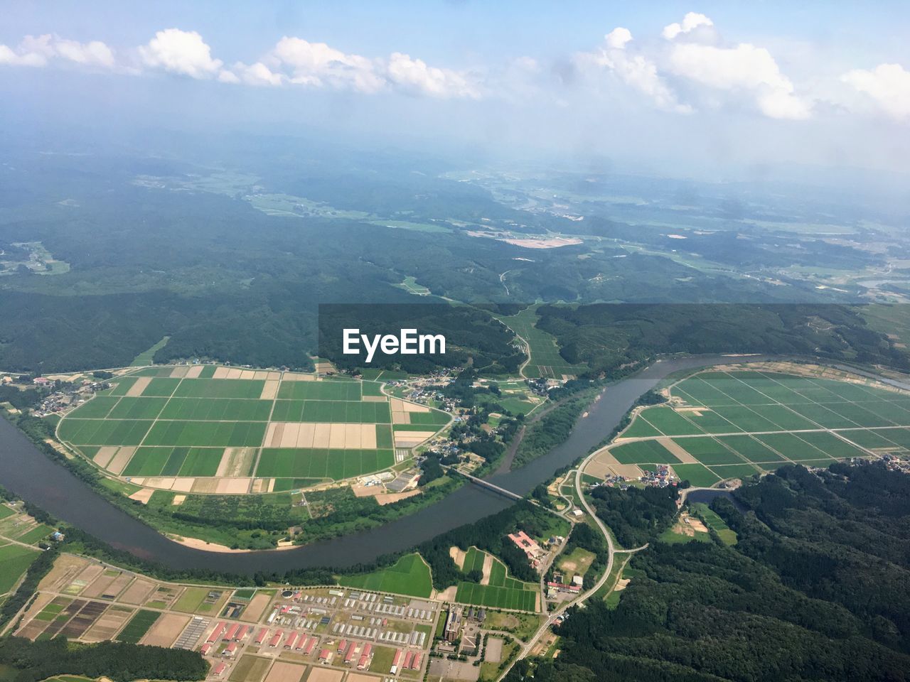 Aerial view of agricultural landscape against sky