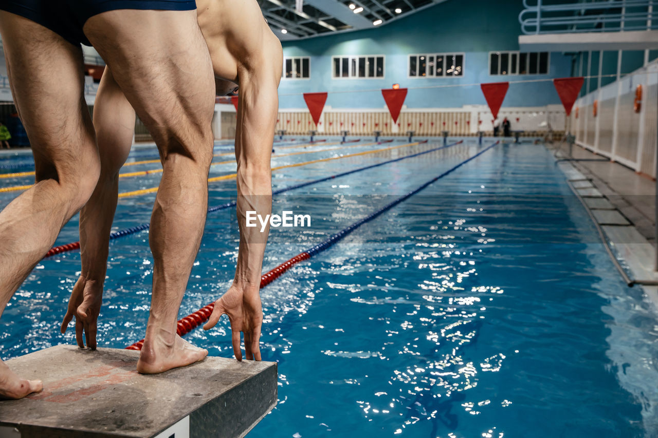 PEOPLE SWIMMING IN POOL