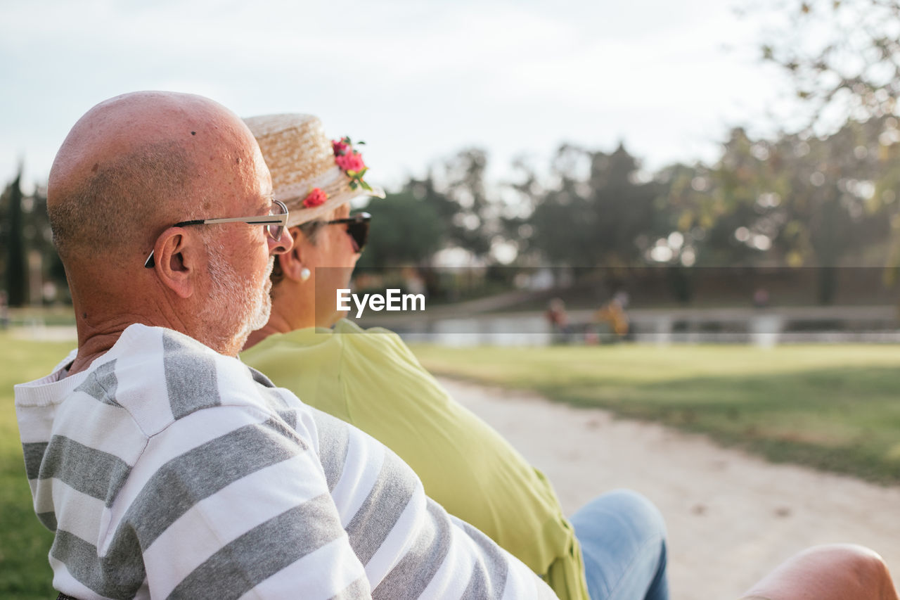 Pensioners couple sitting on a park