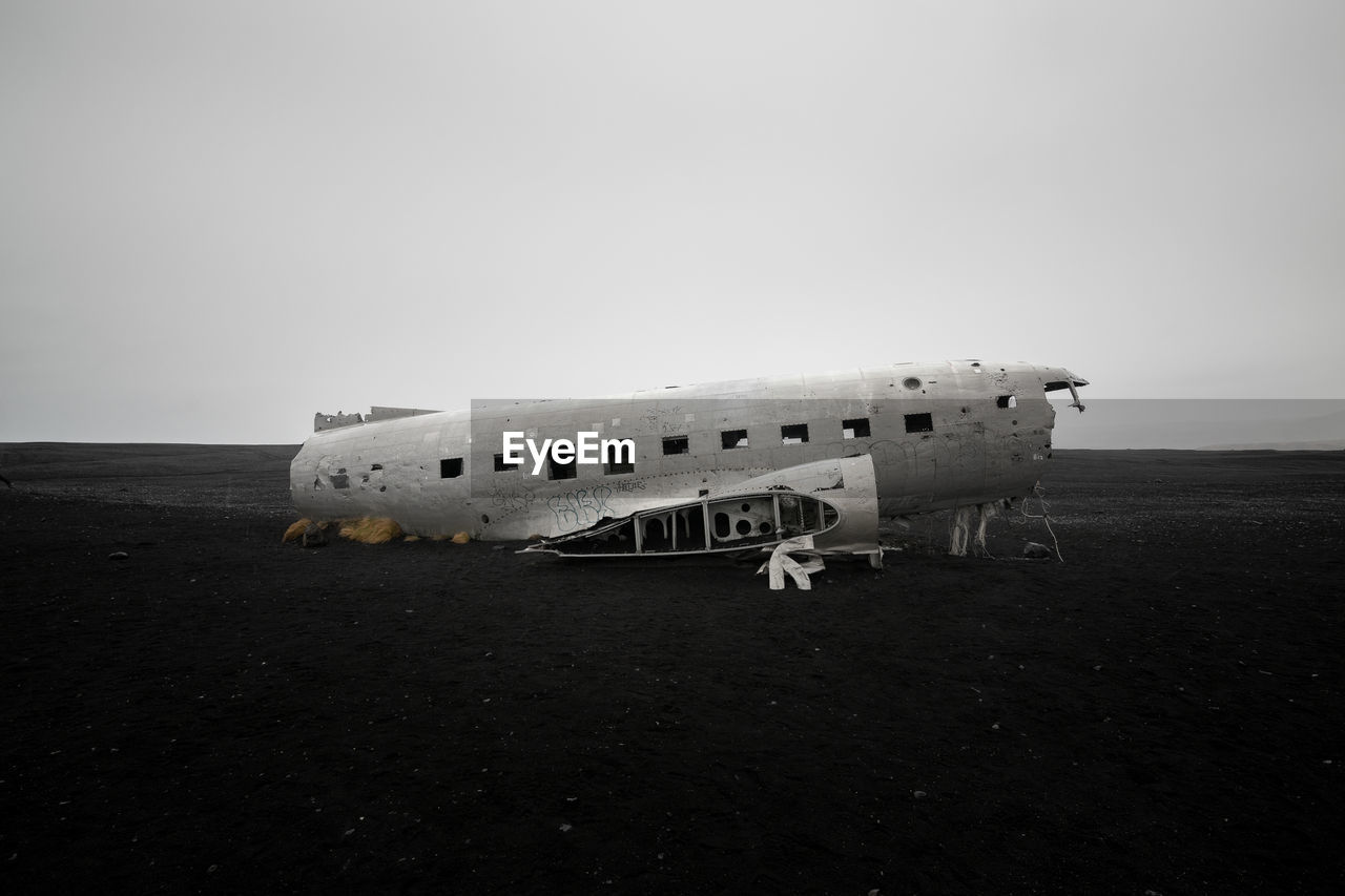 View of the wreckage of an american dc-3 military plane crashed on a beach in iceland