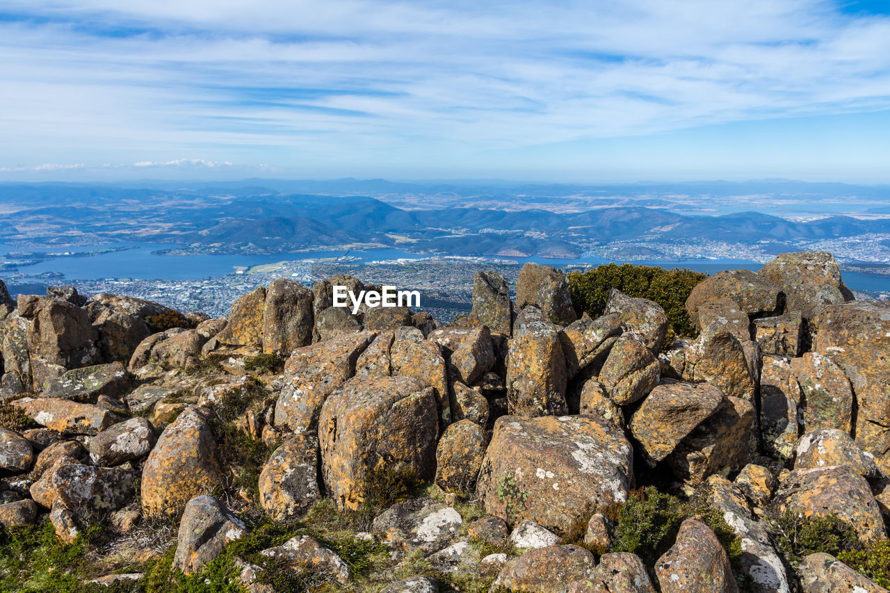 Panoramic view of sea and mountains against sky