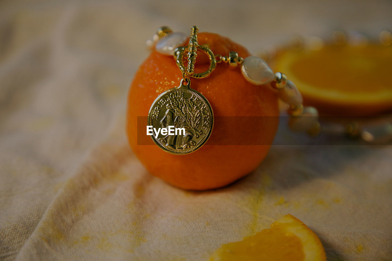 yellow, orange, produce, no people, food, food and drink, indoors, orange color, fruit, close-up, clementine, still life, healthy eating, focus on foreground, citrus fruit, fashion accessory