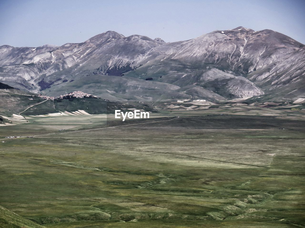 Scenic view of landscape and mountains against sky