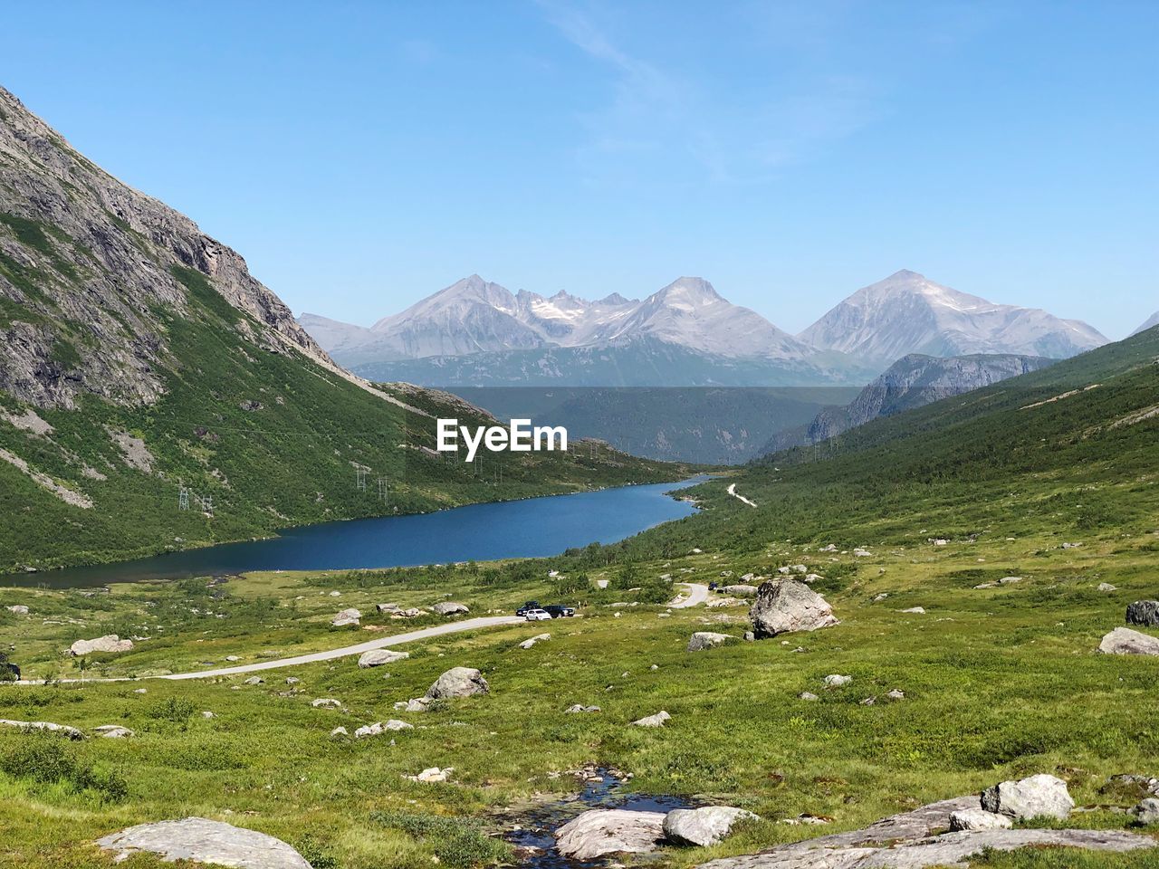 Scenic view of lake and mountains against sky