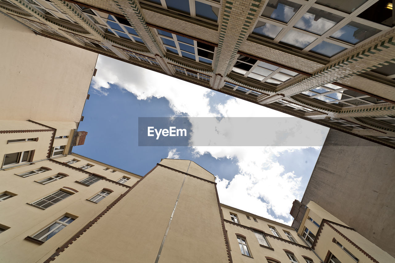 LOW ANGLE VIEW OF BUILDINGS AGAINST SKY