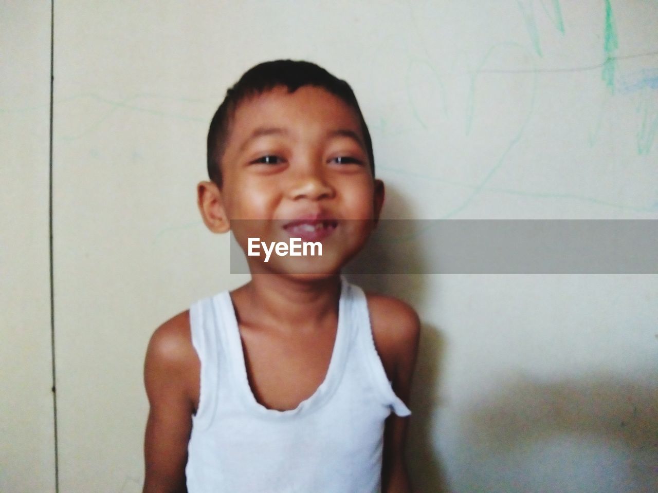 PORTRAIT OF A SMILING BOY