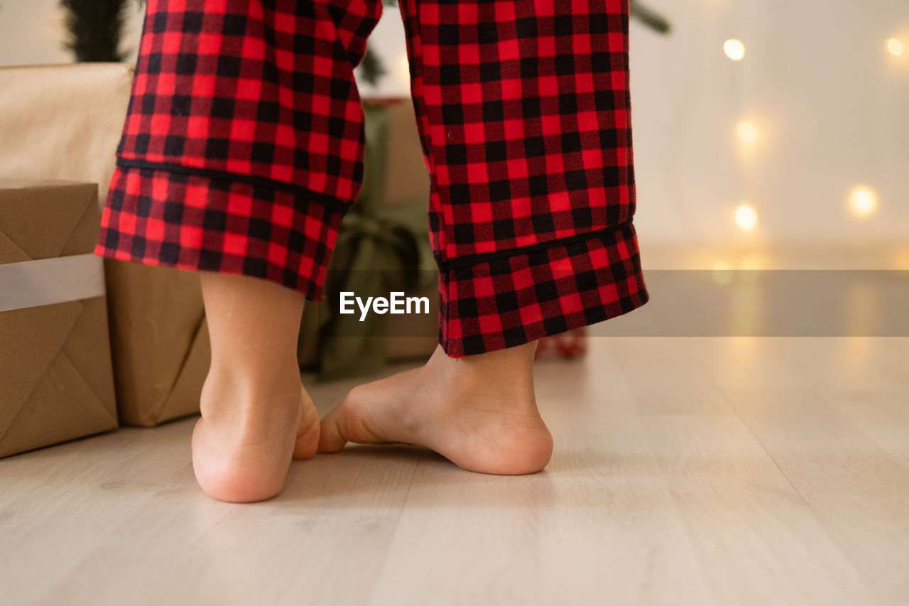 low section of woman walking on floor