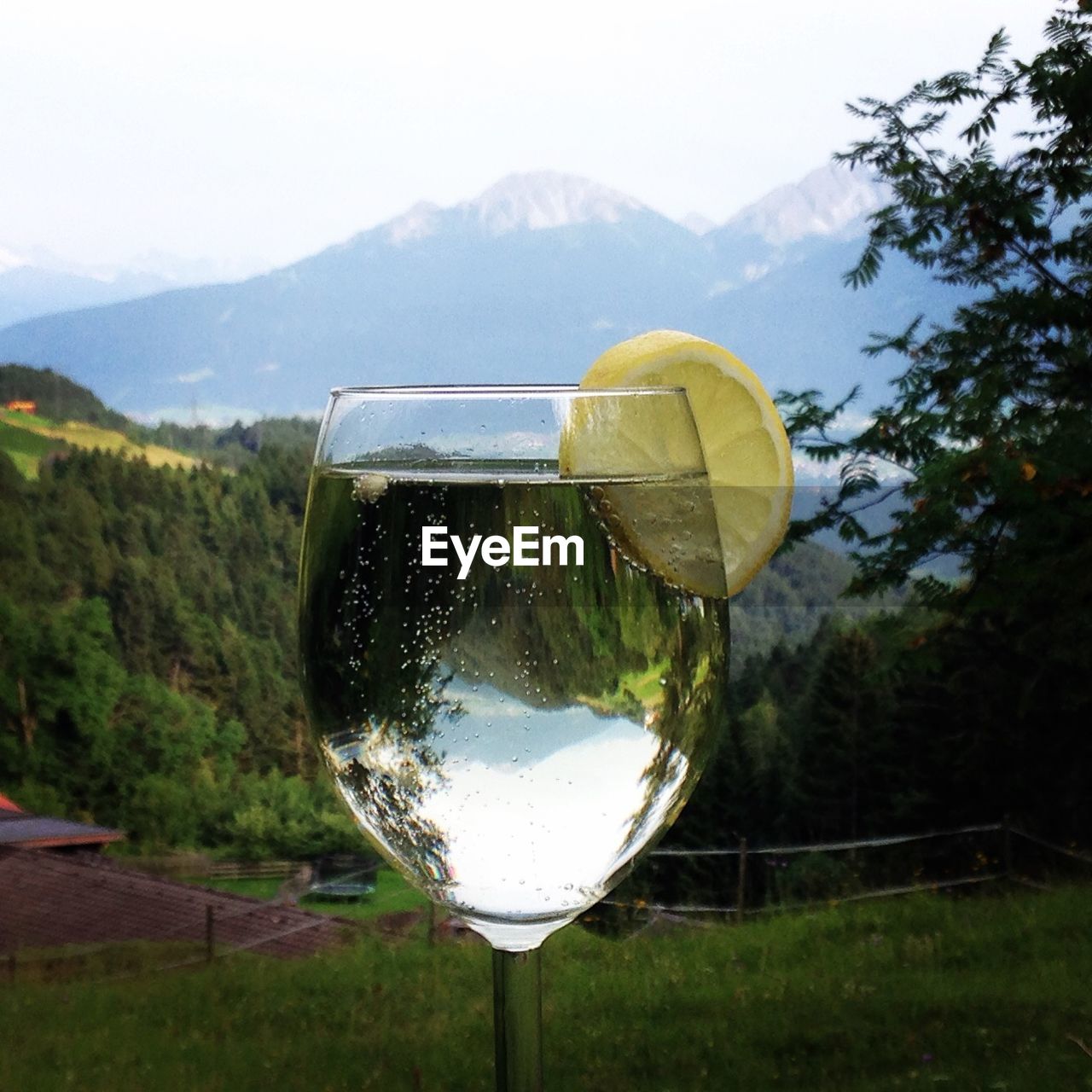 CLOSE-UP OF WATER AGAINST MOUNTAIN RANGE