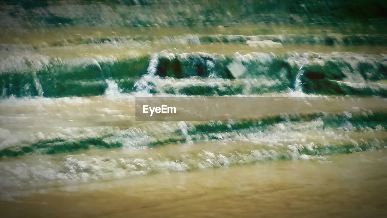 WATER FLOWING THROUGH ROCKS