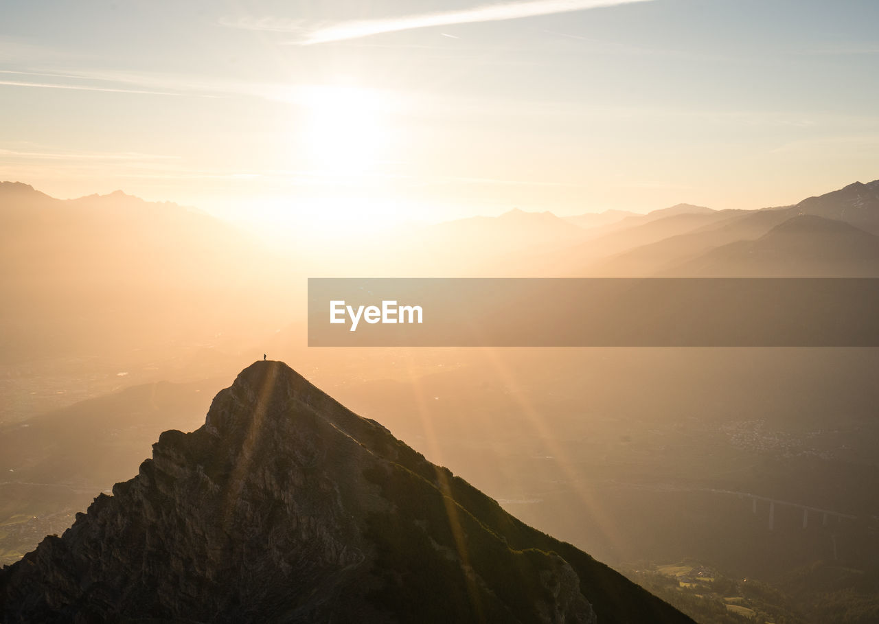 Scenic view of mountains against sky during sunset