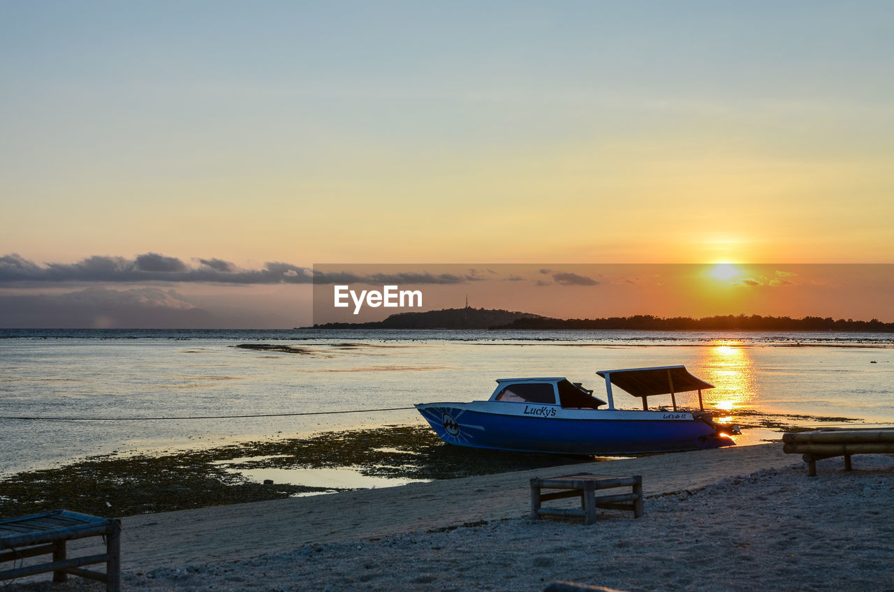 SCENIC VIEW OF SUNSET OVER SEA