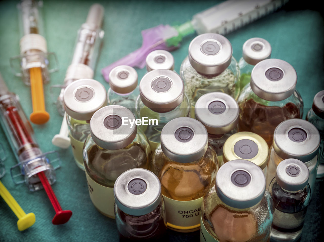 HIGH ANGLE VIEW OF VARIOUS BOTTLES IN CONTAINER