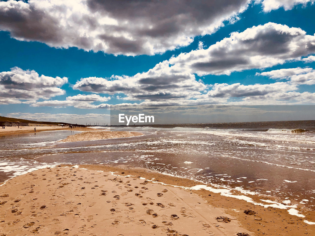 Scenic view of beach against sky